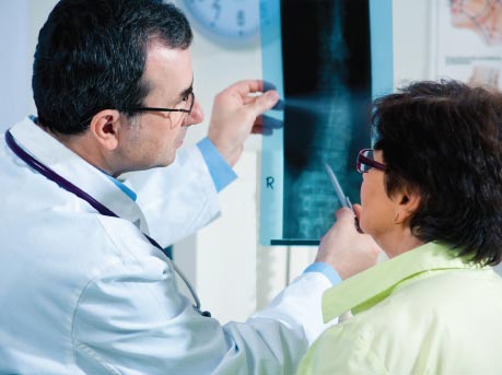 Doctor reviewing xray with patient